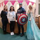 Centre staff members Emma Andrews and Kelly Dela Pena with Captain America and Cinderella.