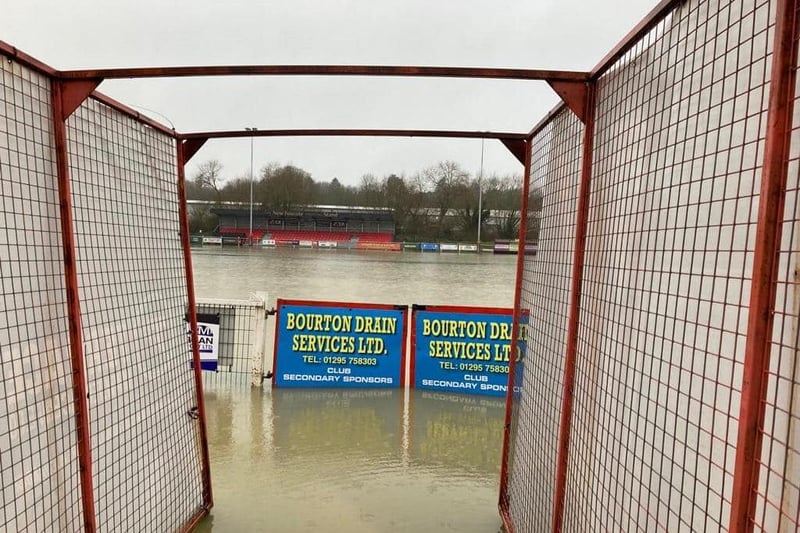 Some appropriate targeted advertisement at Banbury United's waterlogged ground.
