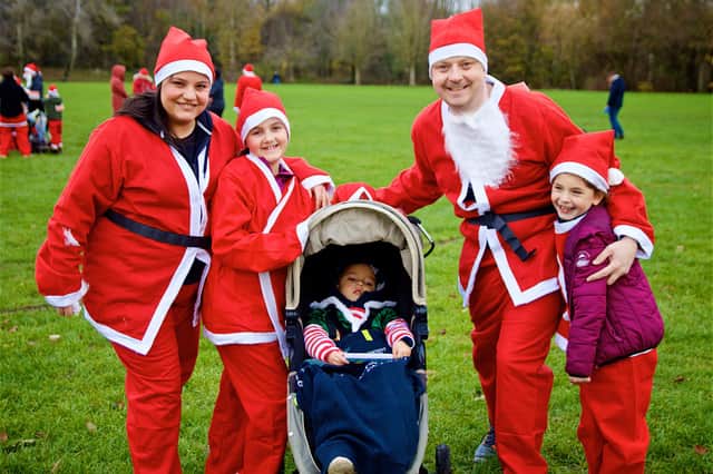 Stephanie Worthy taking part in the Katharine House Hospice Santa Fun Run with her family.