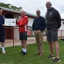 Chris Lowes, left, Head of Oxford United in the Community, is pictured with Easington Sports FC marking the formal partnership between the charity and football club