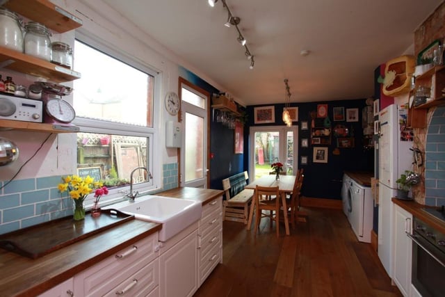 The kitchen/breakfast room has a modern homely feel with its combination of tiles and floorboards.