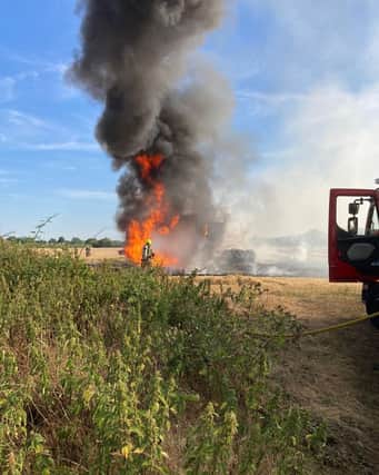 Firefighters tackle a field blaze