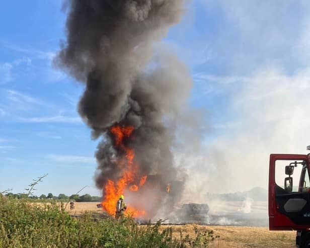 Firefighters tackle a field blaze