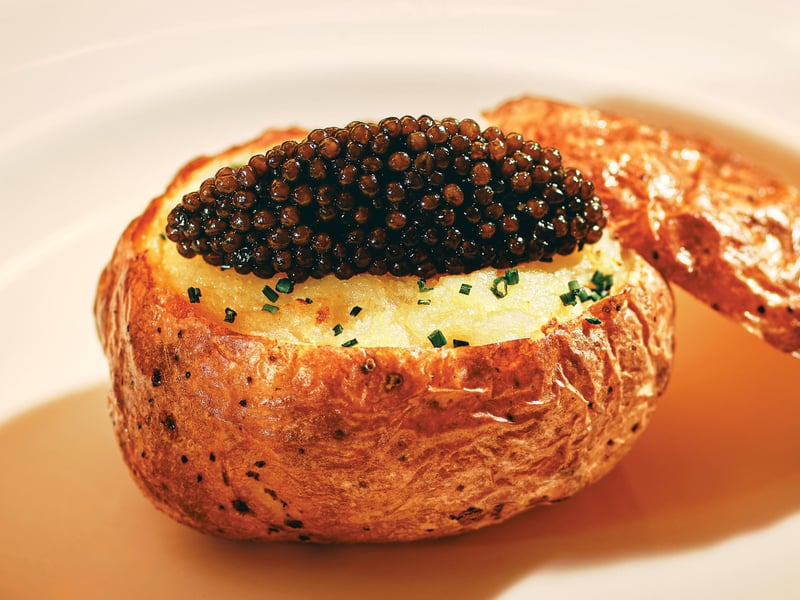 Petrossian Kaluga Caviar, Chives and Crème Fraîche top this Parisian Petite Baked Potato