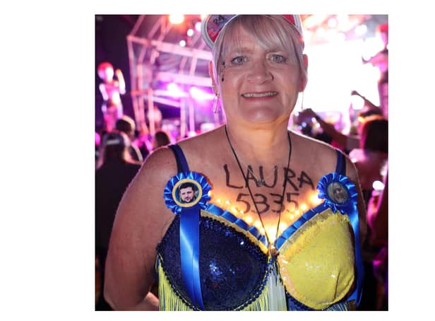 Laura Rothwell wearing blue and yellow bra in support of her heroes in Ukraine including President Zelensky at the Walk the Walk Moonwalk walking through London wearing decorated bras fundraising for breast cancer charities doing a marathon overnight. 
Photo by: Paul Brown/epic-fotos.com