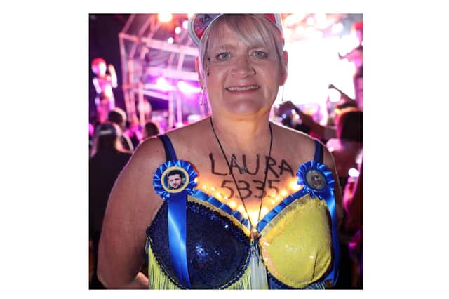 Laura Rothwell wearing blue and yellow bra in support of her heroes in Ukraine including President Zelensky at the Walk the Walk Moonwalk walking through London wearing decorated bras fundraising for breast cancer charities doing a marathon overnight. 
Photo by: Paul Brown/epic-fotos.com