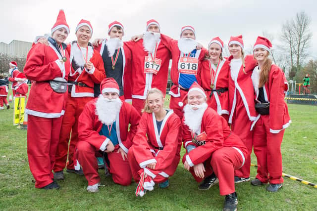 Alicia Richardson in the centre, at last years Santa fun run with her friends and family.