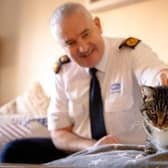 Dermot Murphy, RSPCA inspectorate commissioner, with one of the charity's rescued cats