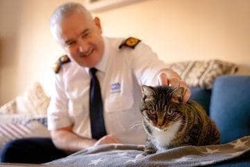 Dermot Murphy, RSPCA inspectorate commissioner, with one of the charity's rescued cats