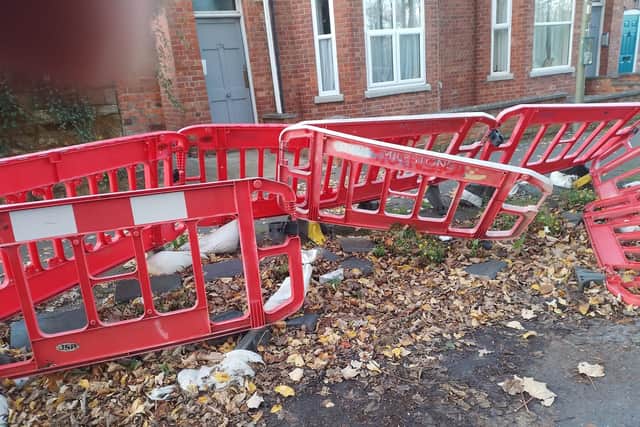 The barriers which have surrounded a collapsing footpath in Broughton Road for over two years