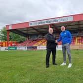 New boss Mark Jones is welcomed by Banbury United chairman Ronnie Johnson. Picture courtesy of Banbury United FC