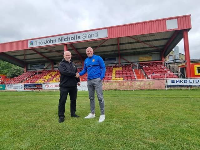 New boss Mark Jones is welcomed by Banbury United chairman Ronnie Johnson. Picture courtesy of Banbury United FC