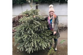 Carley Lambert from Katharine House Hospice with one of the recycled Christmas trees.