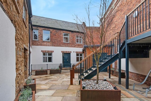 The apartment has a beautifully landscaped and illuminated courtyard with natural sandstone paving and a striking Acer tree.