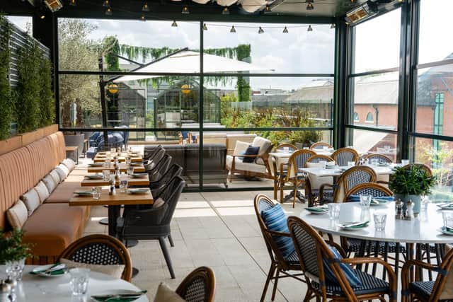 The Greenhouse Restaurant, perfectly situated above the Oxford Canal within the Castle Quay Waterfront shopping and entertainment centre