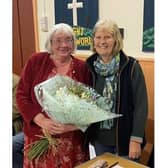 Chair of the Adderbury Parish Council,  Diane Bratt presenting flowers to Ann Lyons.
