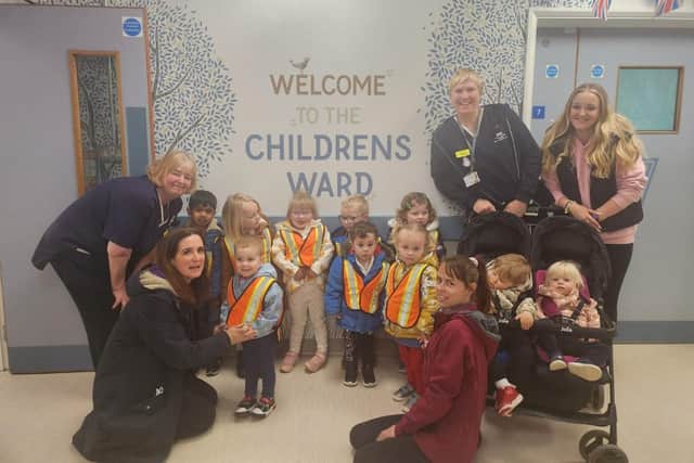 The children and staff of Little Sparrows visting the ward.