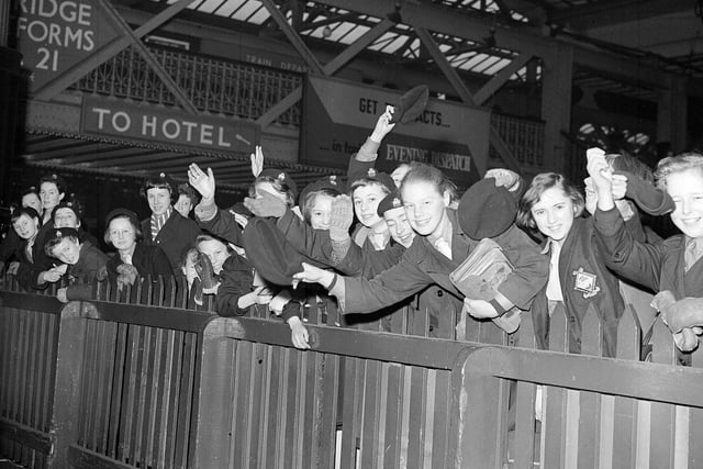 Guides wave at Lady Baden Powell on her arrival at Edinburgh Waverley Station in March 1959.
