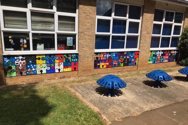 The project, called 'we fit together', is made up of over 300 jigsaw pieces on the walls of Christopher Rawlins Primary School in Adderbury