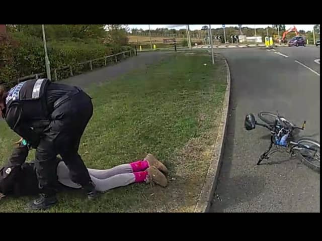 A woman has been charged with 11 offences after being arrested while attempting to escape from the police on a bicycle.
