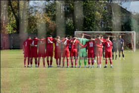 Easington Sports FC players observe a minute’s silence for Esme before their match against Northampton Chenecks on Saturday, October 10. (Photo credit Megan Bottoms)