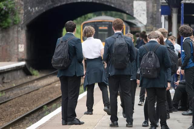 Schoolchildren awaiting the arrival of a Northern service.