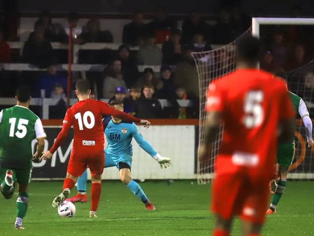 James Armson wrapped up the points with this cool finish for his second goal in Brackley Town's 3-0 success over Kettering Town. Pictures by Peter Short