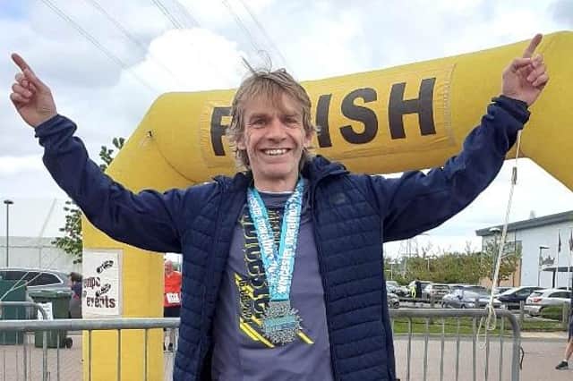 Mission accomplished... Mark Rogers celebrates going under three hours in last year's Worcester Marathon, an achievement that has seen him secure a place for October's London event.