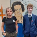 Wykham Park Academy students Geoffrey Woodward and Chloe Watts stand in front of a maths mural at the school with its artist - Lucy Barnes (photo from the school)