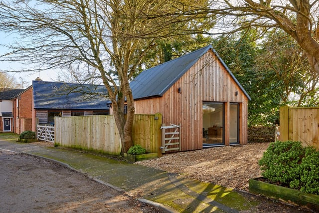 The wooden-clad annexe features a workshop, which George Fisher used to store woodworking machinery as well as his much-loved handcrafted cedar-strip canoe.