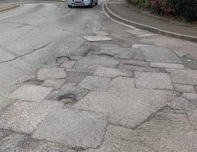 The road surface at the junction of Chatsworth Drive and Whimbrel Way, Banbury which residents say needs fully replacing