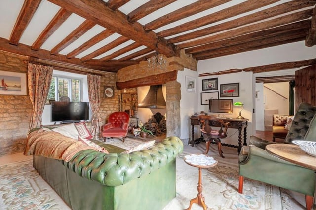 The sitting room has feature stone works, exposed beams, inglenook fireplace and windows to the front and rear.