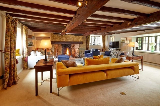The large sitting room with wooden beams inside The Old Manor.

Photo: Savills