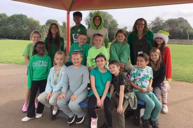 Pupils and staff at the school raised £159.50 for charity by dressing in green outfits for the day.