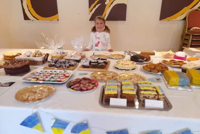 Banbury area school girl seven-year-old Charlotte (at right) organised a village cake sale to help children in Ukraine. (photo from Charlotte's mother, Louise Coopman)