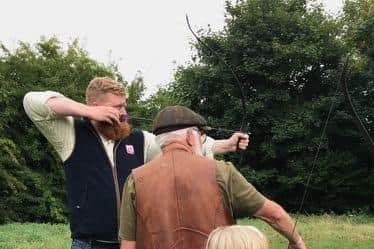 Barry Bryant-Kobil demonstrating archery to visitors at Hornton History Group's weekend of activities.