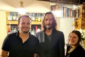 Danny Ricks and Laura James said they "managed to keep it together" while serving Keanu Reeves at The Fox and Hounds at Charwelton.