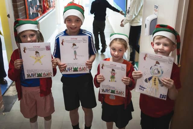 Competition winning students, Nancy, Sofia-Rose, Florence and Joseph with their Elf designs.
