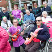 Residents of Seccombe court getting in the party spirit. L-R: Back Row is Alan Nichols, Kristina Bojthe, Julie Mullins,Belinda Bird, Patricia Searle. Front Row is Wendy Hopkins, Cyril Allen, Layla Golby, Tony Russell, Clifford Storr, Phyllis Harris.