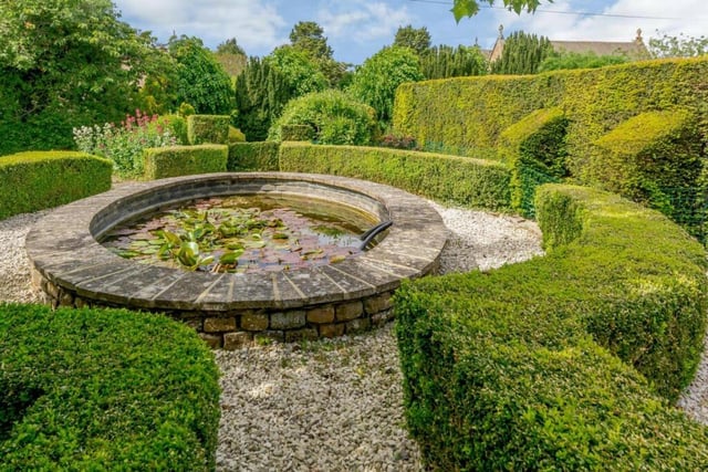 The house has beautifully maintained private gardens.