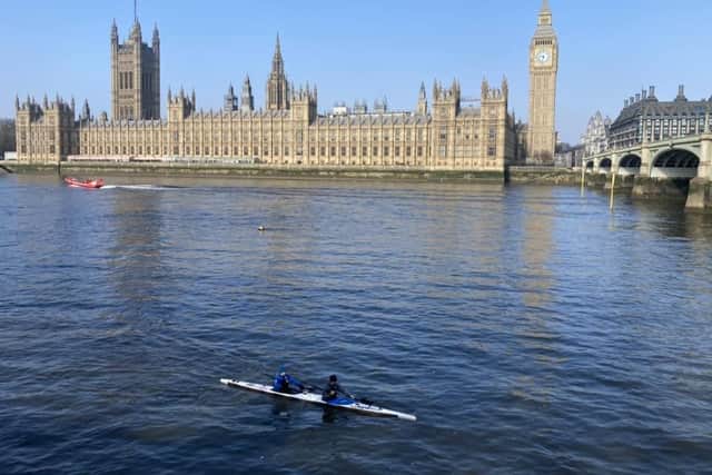 Banbury-based paddlers Joe Petersen and Shaun Harte passing in front of the Palace of Westminster.