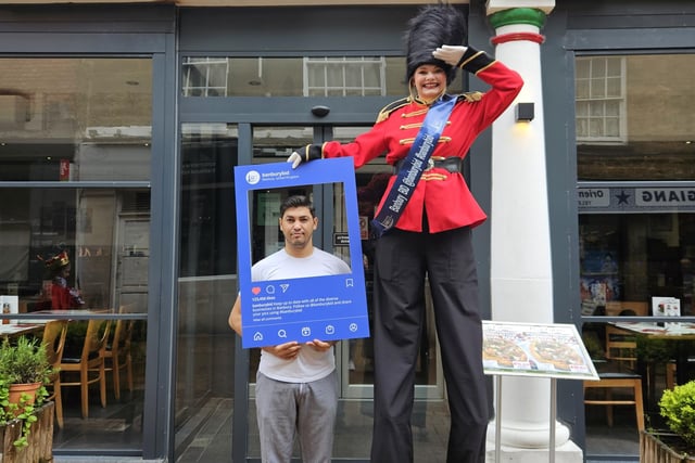 Stilt-walking guards ensured visitors to the town centre had smiles on their faces.