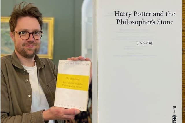 Jim Spencer of Hanson's Auctions with the rare copy of The Philosopher's Stone.