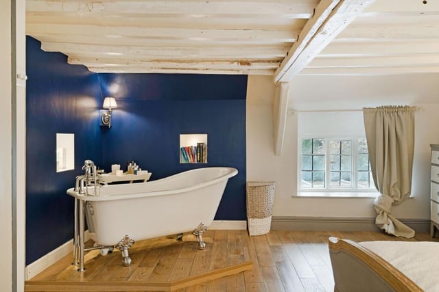 The master bedroom features a free standing bath.