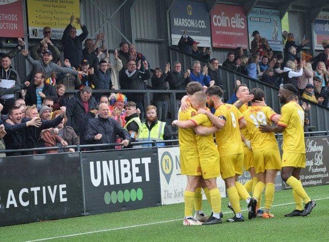 Banbury United celebrate one of their goals in the 3-3 draw at Scarborough Athletic on the final day of the National League North season. Picture by Julie Hawkins