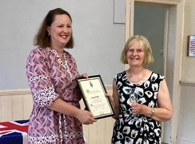 Victoria Prentis MP presents Cllr Diane Bratt, chairman of the Adderbury Parish Council, with The High Sheriff’s award.