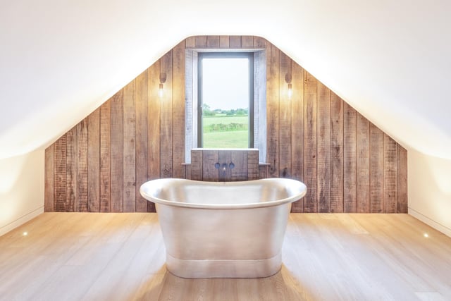 The first floor suite has a freestanding bath by London Encaustic and engineered oak flooring.
