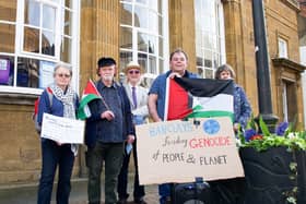 NOSA protesters Maria Huff, Phil Richards, Steve Kilsby, Simon Garrett and Julie Battison are pictured outside Barclays Bank on Saturday