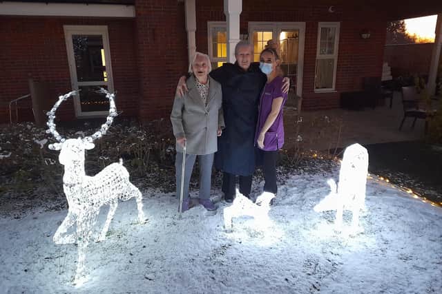 Seccombe Court residents enjoying their festive light display at the home.