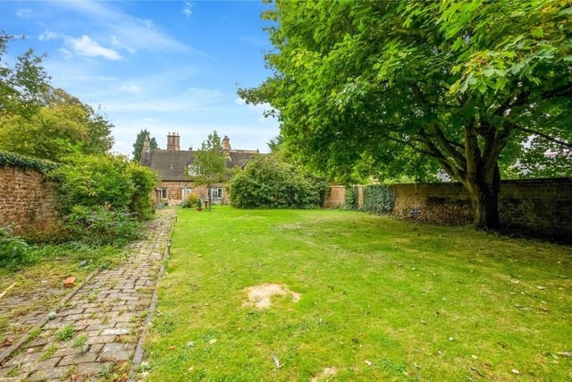 The property has extensive gardens and grounds, both formal and informal, with countryside views to the west.